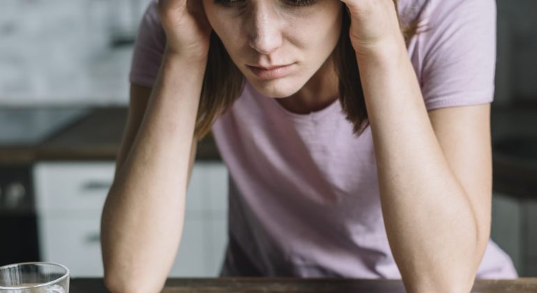 close-up-woman-suffering-from-fever-with-medicines-crumpled-tissue-paper-wooden-desk Why painkillers don't work