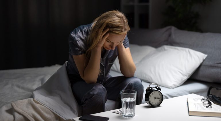 Woman with sleeping disorder in bed When Painkillers Don't Work