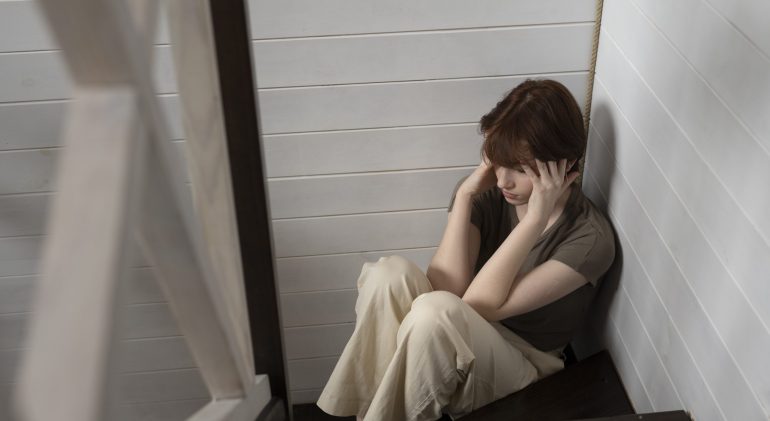 full-shot-woman-sitting-stairs adolescent depression statistics uk